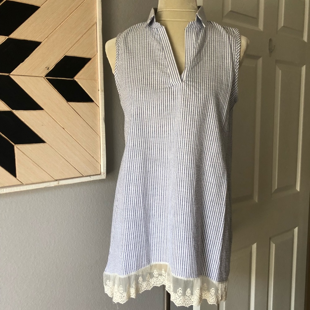 Sleeveless top with lace hem